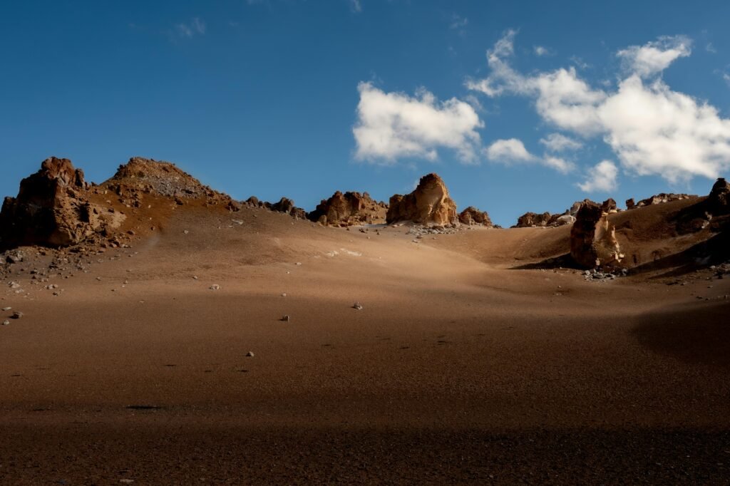 pexels-photo-20923044-20923044 Barren desert landscape in Antofagasta de la Sierra, Argentina, featuring rocky formations under a clear blue sky.